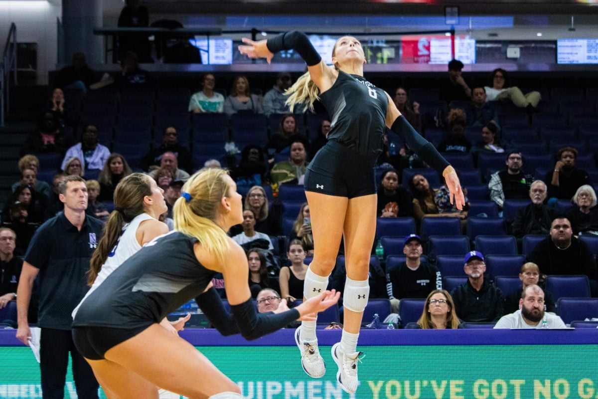 Sophomore outside hitter Averie Hernandez hitting the ball in Friday’s match against Maryland. Hernandez recorded six kills Friday and another 14 on Sunday. 