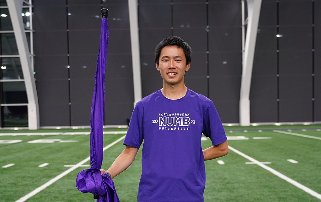 Tong is a member of the NU Marching Band Color Guard and founded the NU Juggling Club.