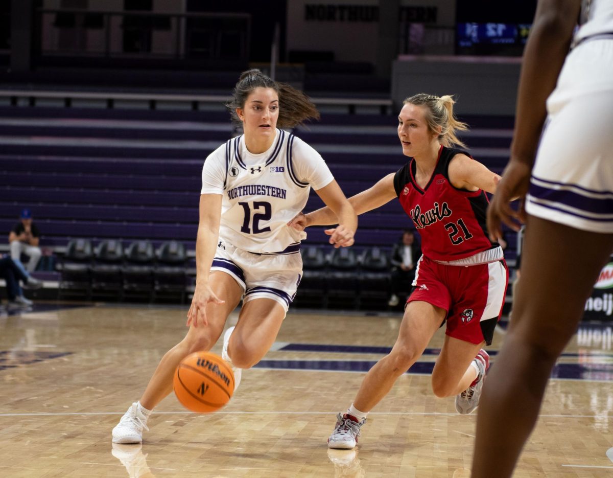 Freshman+guard+Casey+Harter+drives+inside+the+paint+to+score+a+bucket.+Harter+poured+in+a+season-high+14+points+for+the+Wildcats+in+their+loss+Wednesday+against+Loyola-Chicago.