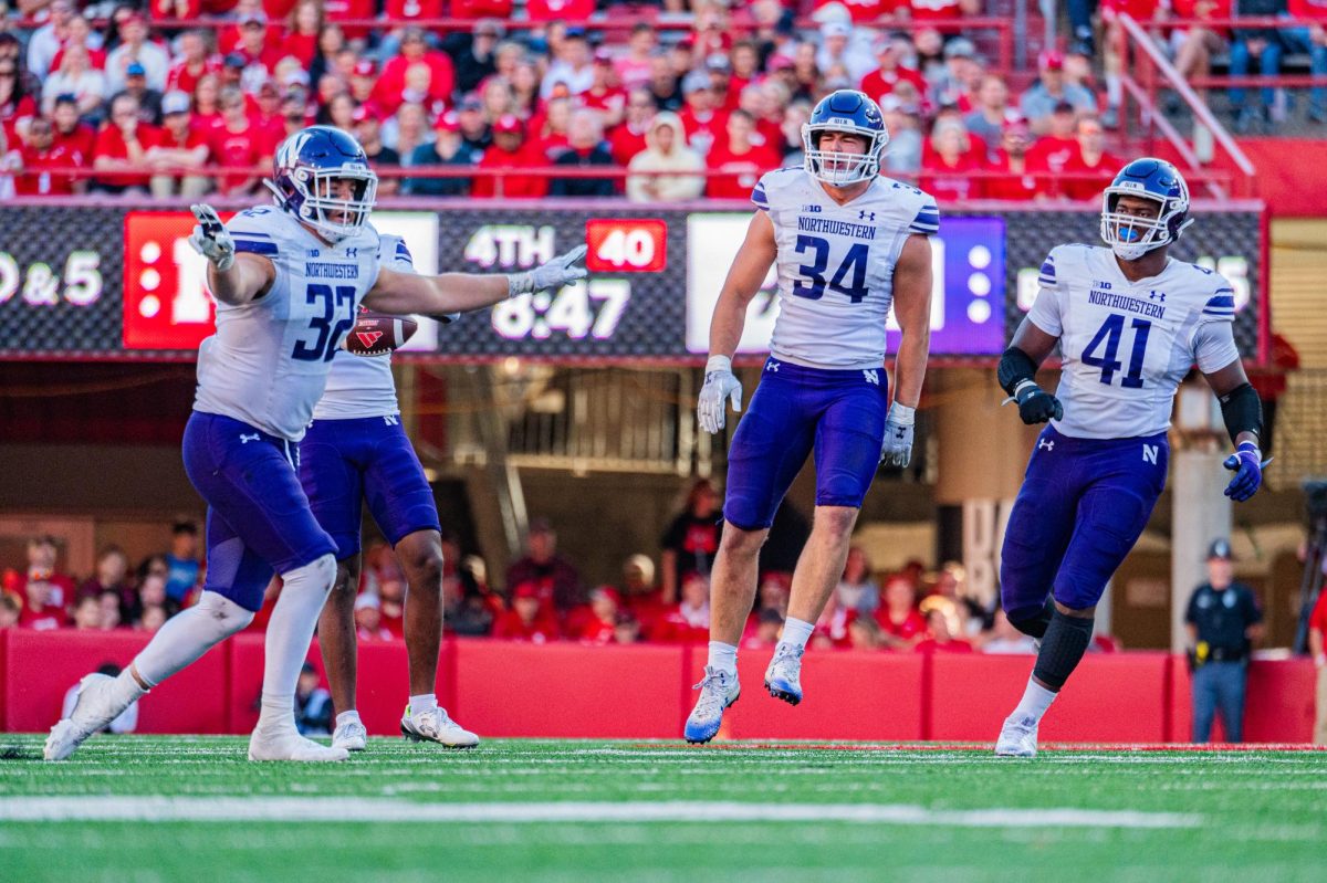 Senior+linebackers+Bryce+Gallagher+and+Xander+Mueller+celebrate+during+Northwestern%E2%80%99s+game+against+Nebraska.+The+pair+of+Wildcat+linebackers+were+named+to+the+All-Big+Ten+defensive+teams+Tuesday.