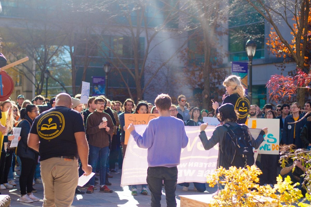 NU community members came to Monday afternoon’s NUGW rally bearing signs, NUGW T-shirts and noise-making devices.