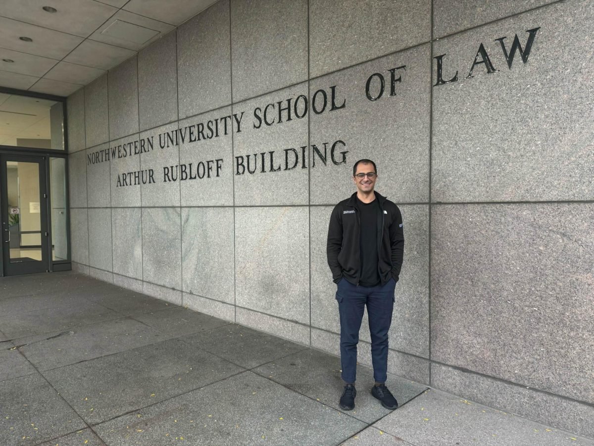 Ostowari poses outside of Northwestern University School of Law.