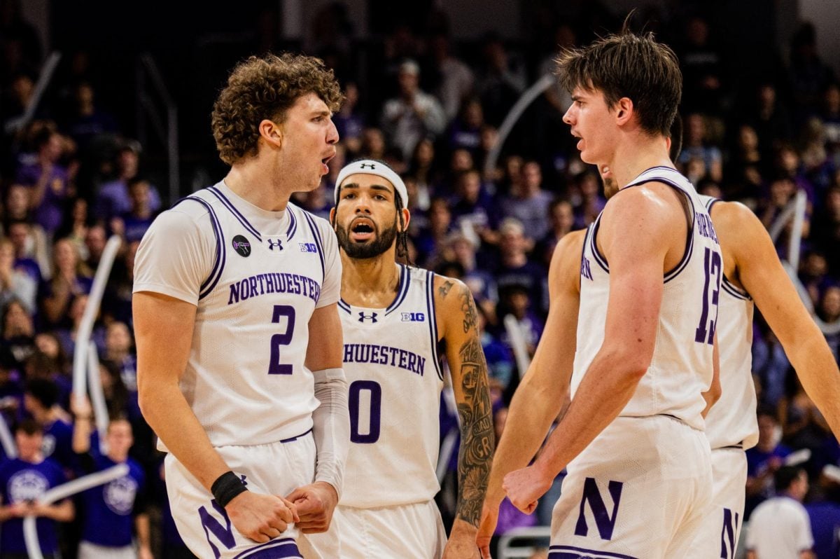 Sophomore forward Nick Martinelli and junior guard Brooks Barnhizer. Barnhizer led Northwestern with a team-high 18 points in its 72-61 win over Rhode Island Saturday.