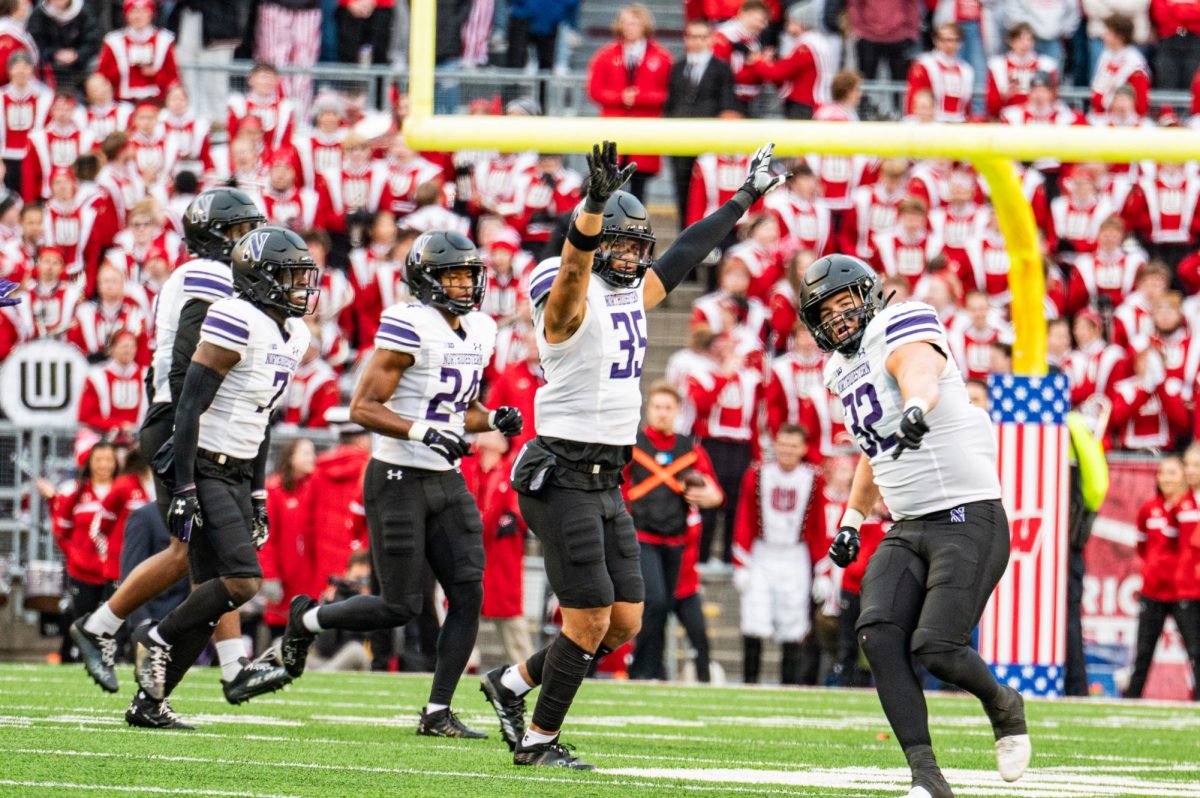 Northwestern%E2%80%99s+defense+celebrates+following+a+stop.+Interim+head+coach+David+Braun%E2%80%99s+defense+came+up+with+stop+after+stop+against+Wisconsin+in+Northwestern%E2%80%99s+24-10+win+Saturday.