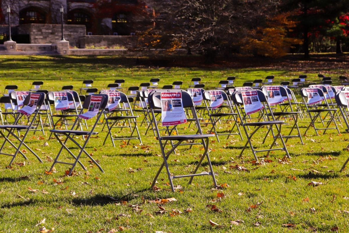 Friday’s demonstration on Deering Meadow was one of many around the world using empty chairs to honor Israeli hostages remaining in Gaza since the militant group Hamas’ Oct. 7 attack on Israel.