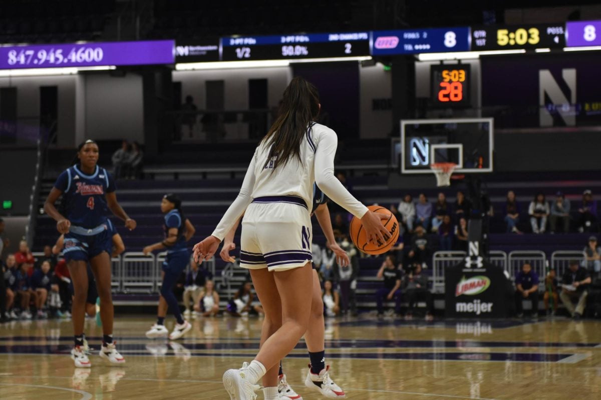 Sophomore guard Caroline Lau dribbles the ball. Lau tallied 15 assists Thursday, one away from the program record set by Nancy Kennelly 30 years ago.