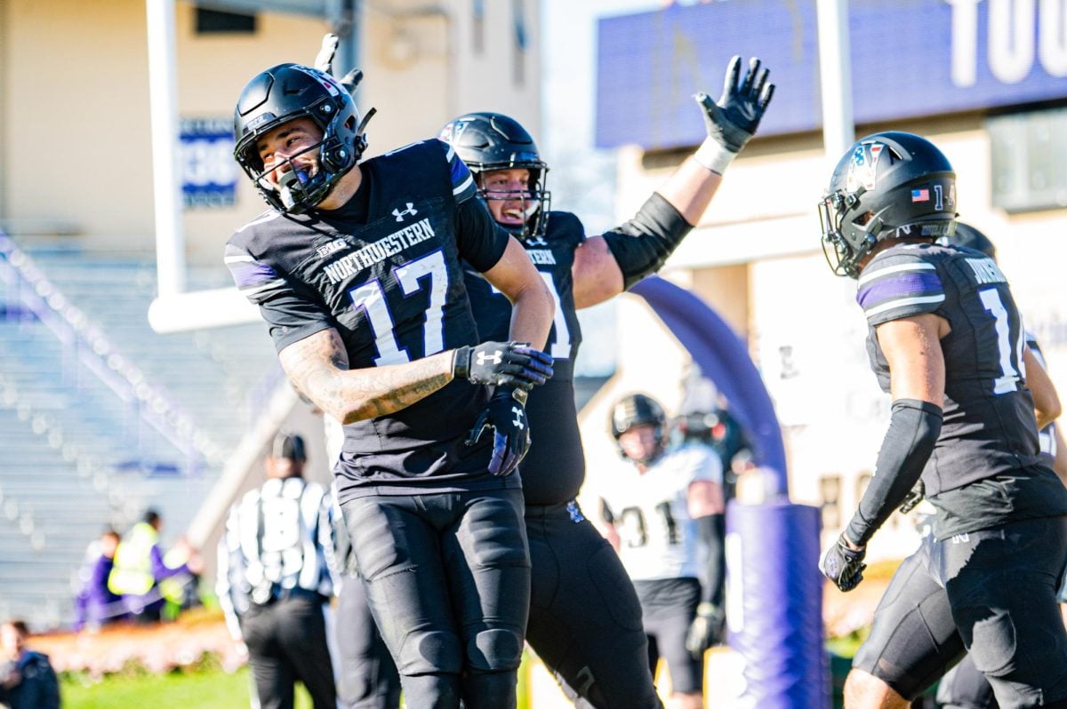 Senior+offensive+lineman+Ben+Wrather%2C+and+wide+receivers+senior+Bryce+Kirtz+and+sixth-year+Cam+Johnson+celebrate+against+Purdue.+The+%E2%80%98Cats+will+be+taking+their+talents+out+west+on+December+23rd+to+face+Utah+in+the+Las+Vegas+Bowl.