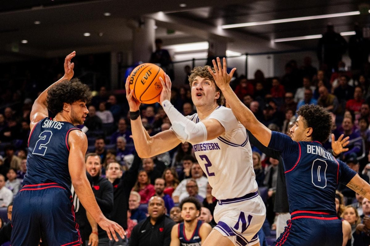 Sophomore forward Nick Martinelli attempts a shot. In Northwestern’s 56-46 victory over DePaul, Martinelli tallied a game-high 16 points.