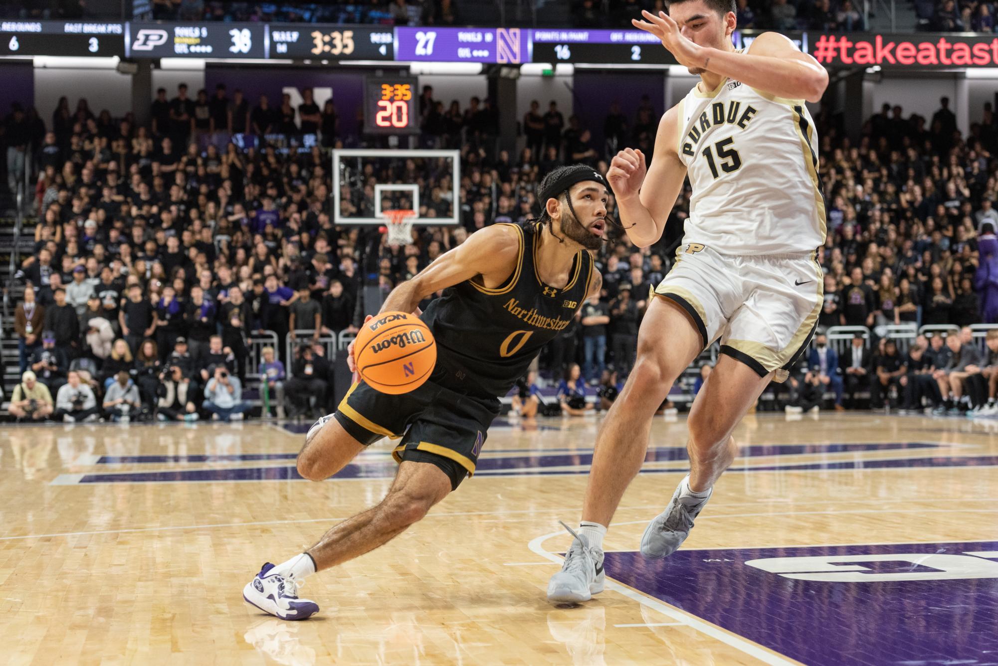 Graduate student guard Boo Buie drives to the rim. In NU’s X over Purdue, Buie recorded a team-high 24 points.  