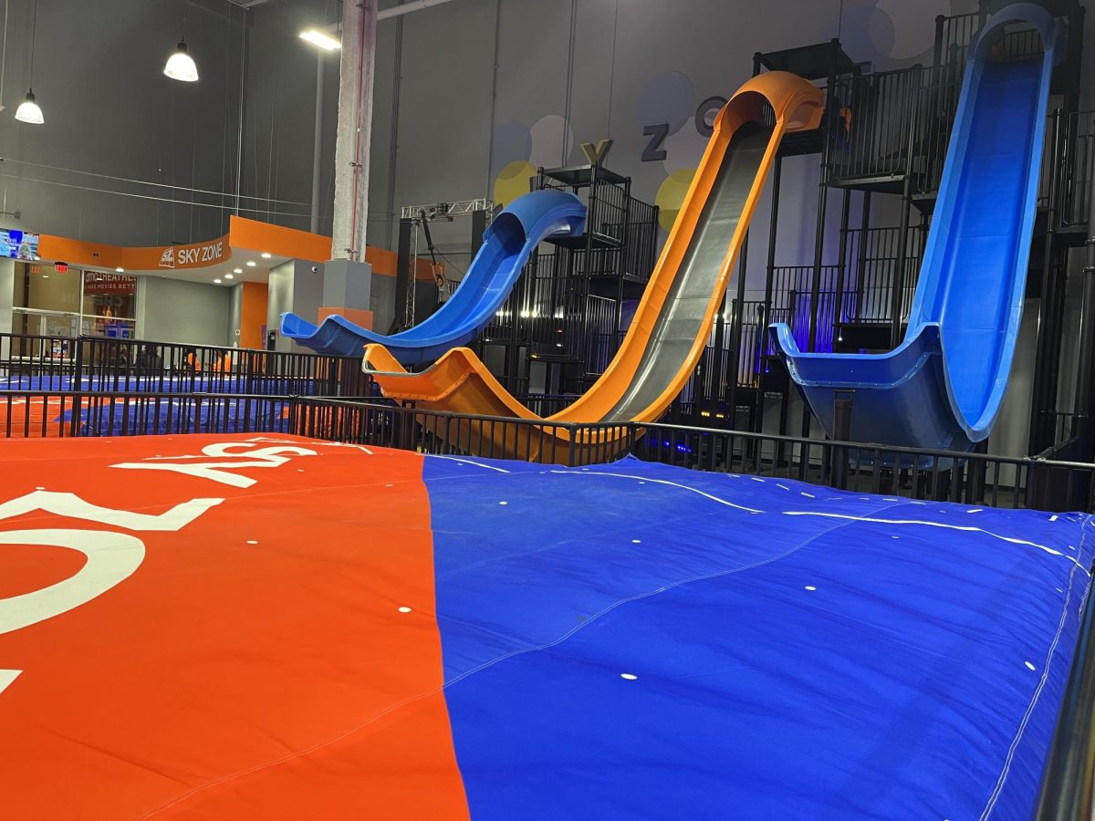 Two large slides and a toddler-friendly playground are among the various attractions at the new indoor Sky Zone park.