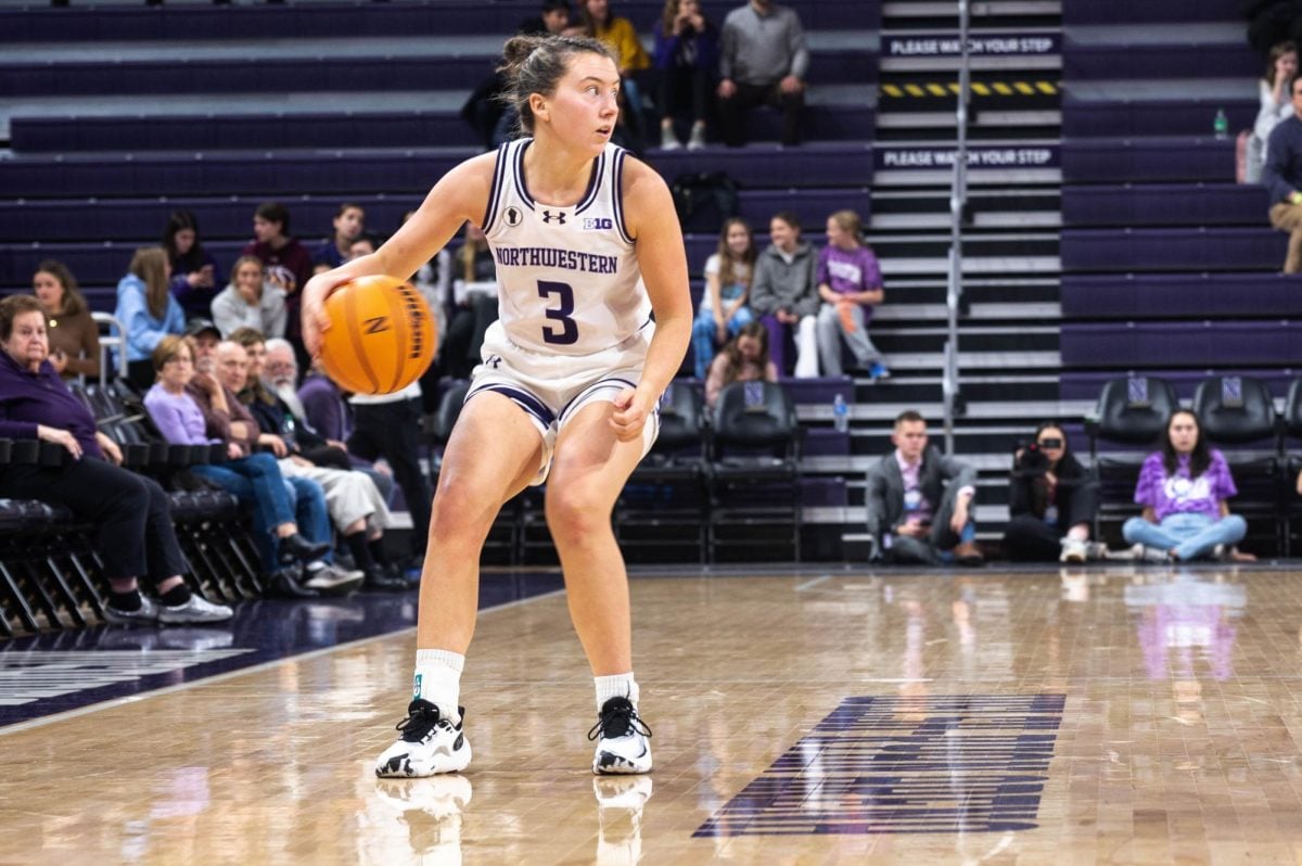 Graduate+student+guard+Maggie+Pina+dribbles+the+ball+up+the+court.+With+her+six+point+performance+against+the+Buckeyes%2C+Pina+is+just+one+point+shy+of+1%2C000+career+points.+