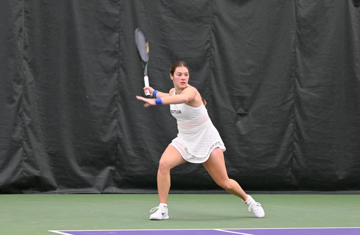 A Butler University Women’s Tennis player swinging her racket.