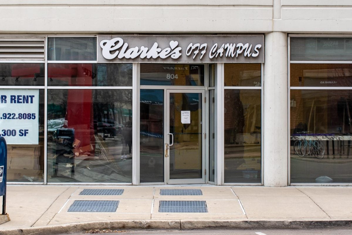 The Clarke’s Off Campus storefront stands empty with a large white sign in the window that says “For Rent.”