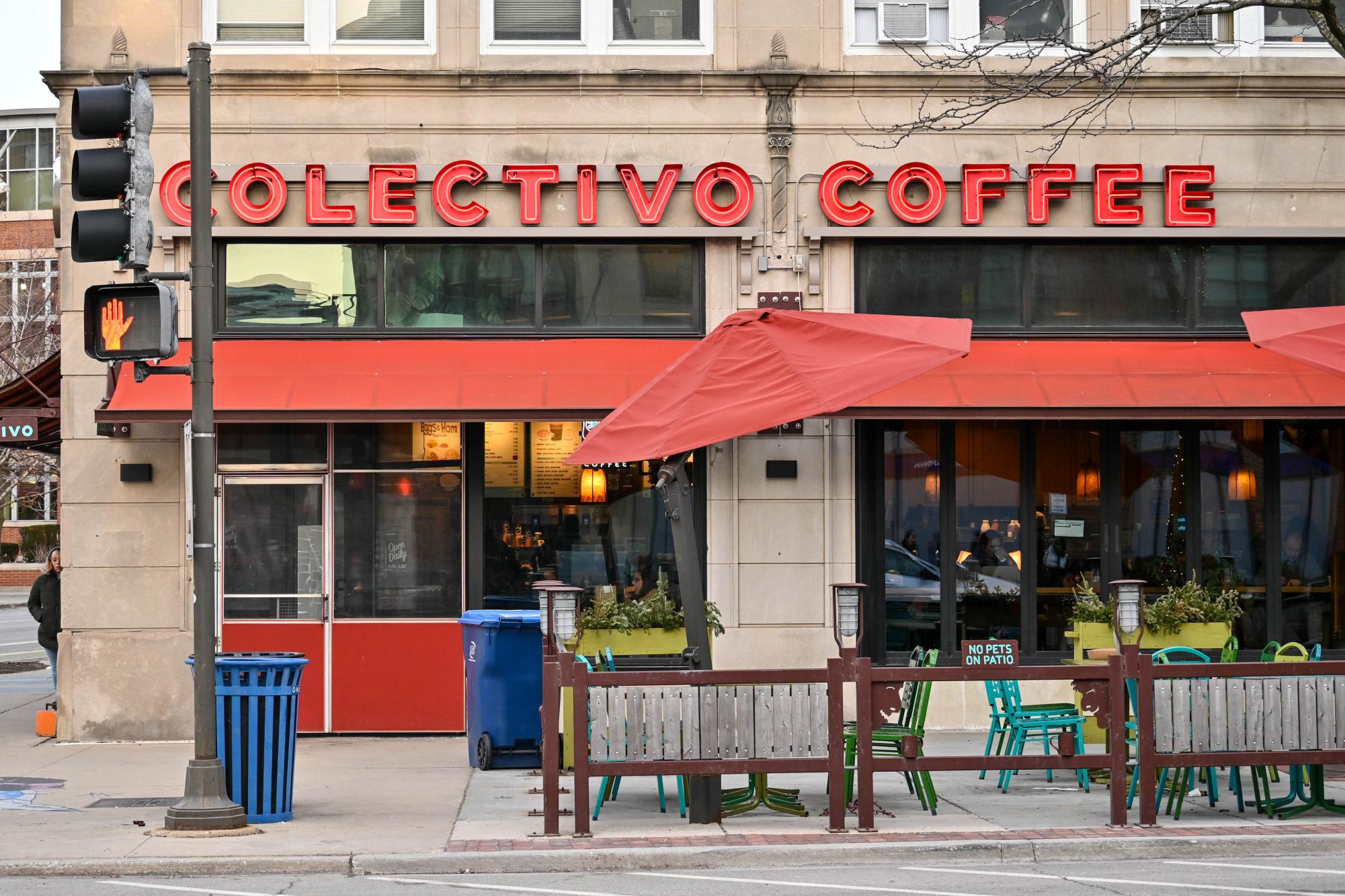Sign that reads “Colectivo Coffee” over a patio.
