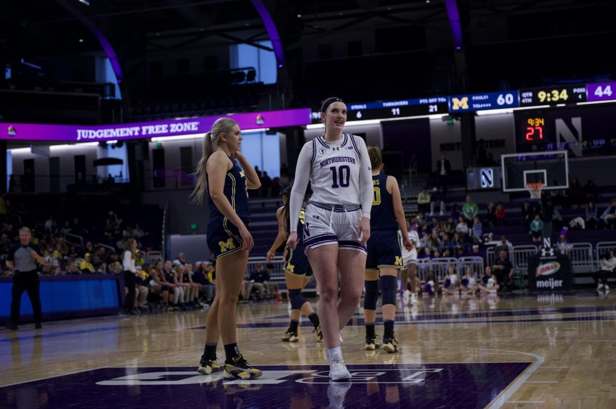 Junior forward Caileigh Walsh smiles as she shines in Saturday afternoon’s matchup versus Michigan at Welsh-Ryan Arena.