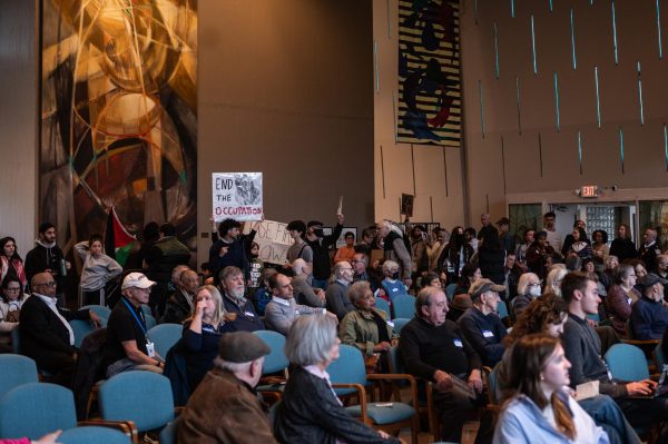Peaceful demonstrators interrupted the Democratic Party of Evanston’s “get out the vote” rally at the Unitarian Church Sunday. 