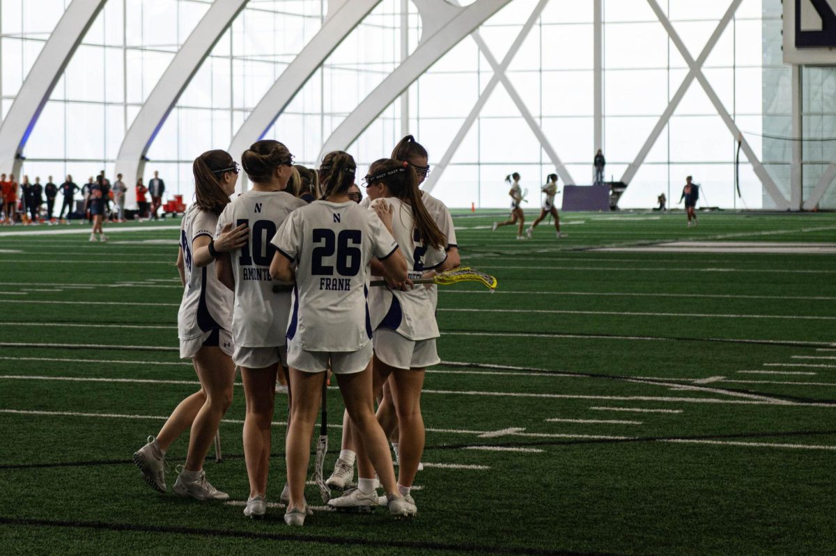 The Northwestern Women’s Lacrosse team groups up for an offensive huddle.