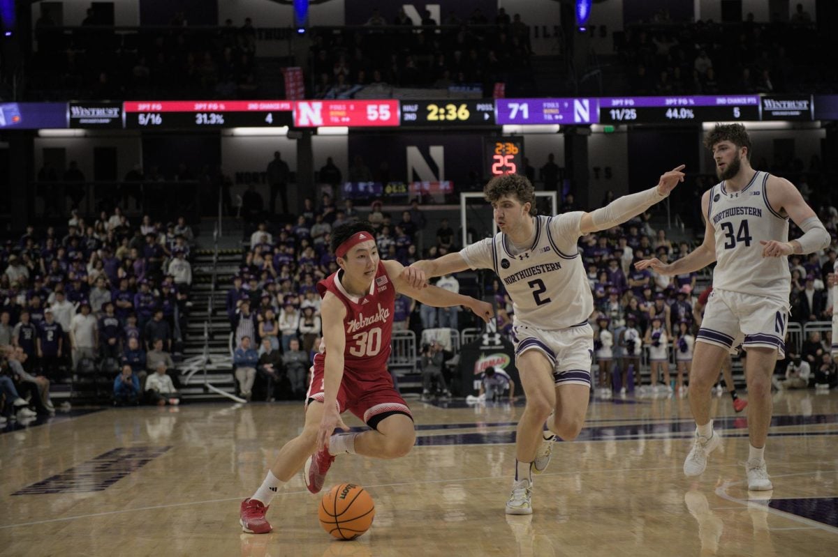 Sophomore forward Nick Martinelli guards Nebraska guard Keisei Tominaga. In Northwestern’s wire-to-wire victory over the Cornhuskers, the ’Cats limited Tominaga to 11 points.