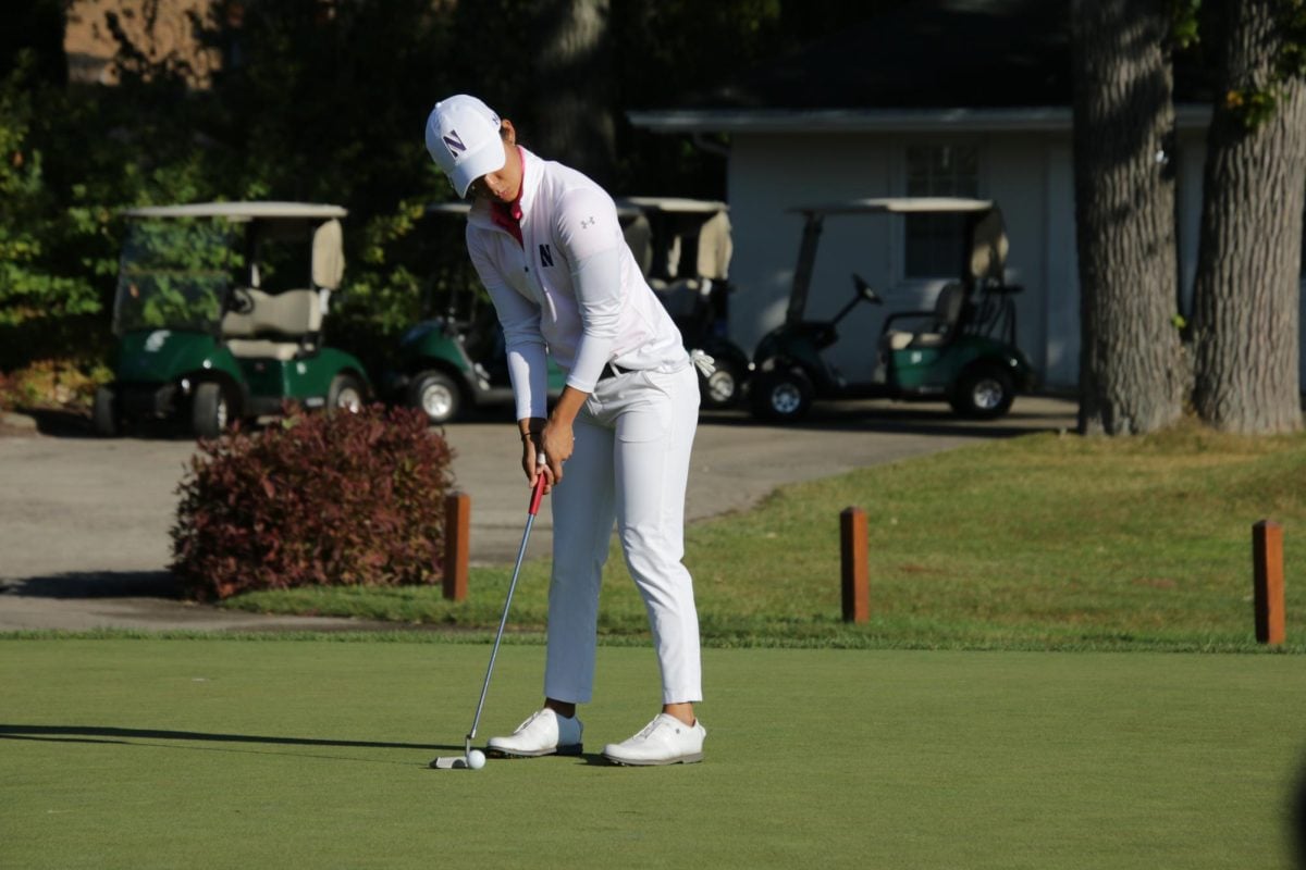 Senior Jennifer Cai prepares to putt the ball. Cai — a 2022 All-Big Ten First Team selection — tied for 39th place in the Moon Golf Invitational hitting a 2-over 74 in each of her three rounds.