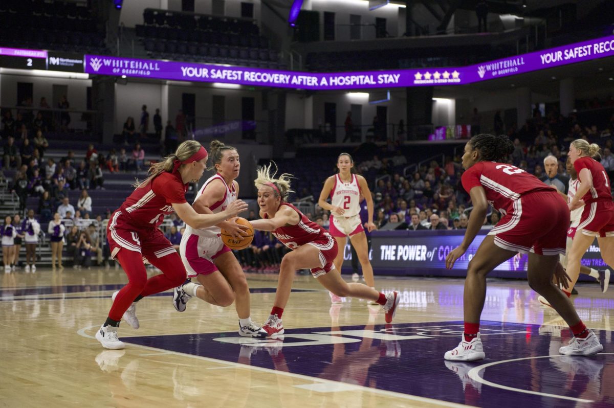 Graduate student guard Maggie Pina fights to keep possession.