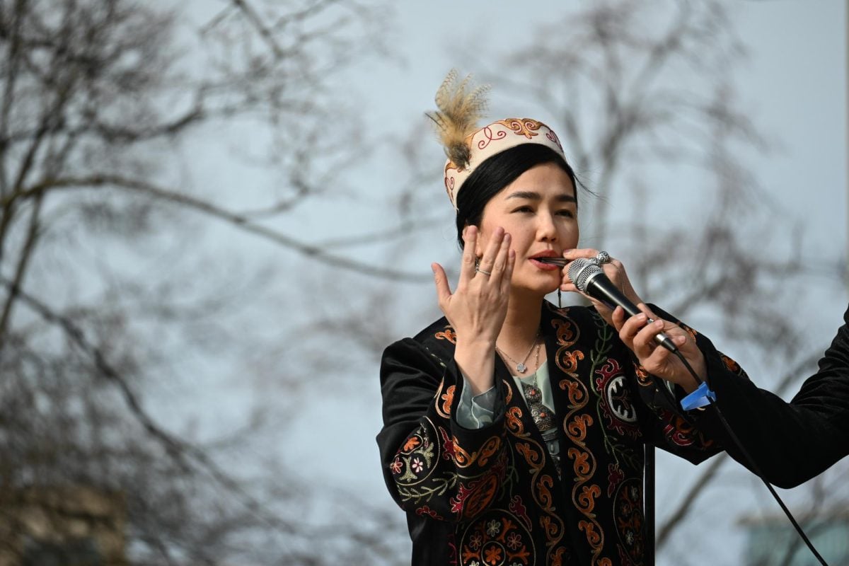 A woman plays the temir komuz, the Kyrgyz jaw harp.