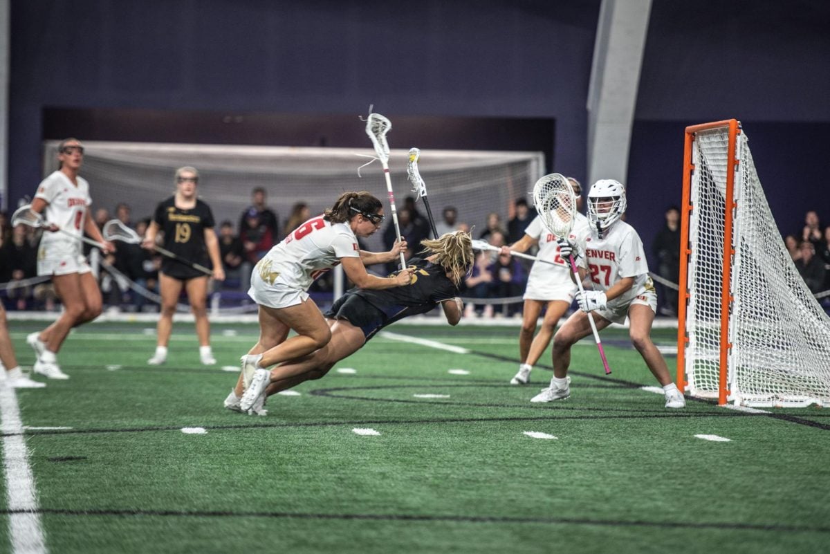 Sophomore attacker Madison Taylor converts a flying finish against Denver Friday. Taylor scored five goals in Northwesterns top-10 victory.