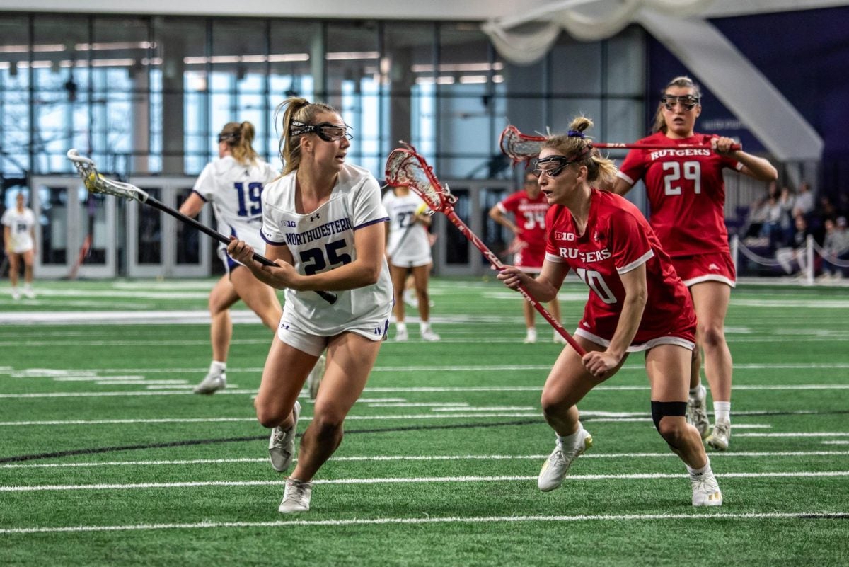 Northwestern sophomore attacker Madison Taylor weaves toward the goal during the Wildcats’ 22-11 win over Rutgers Saturday. Taylor and graduate student attacker Izzy Scane each scored a team-high four goals. 