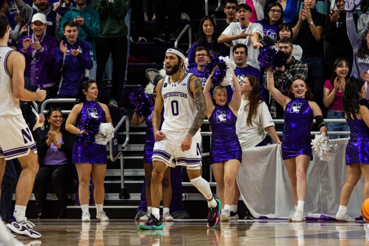 Graduate student guard Boo Buie celebrates during game action at Welsh-Ryan Arena.