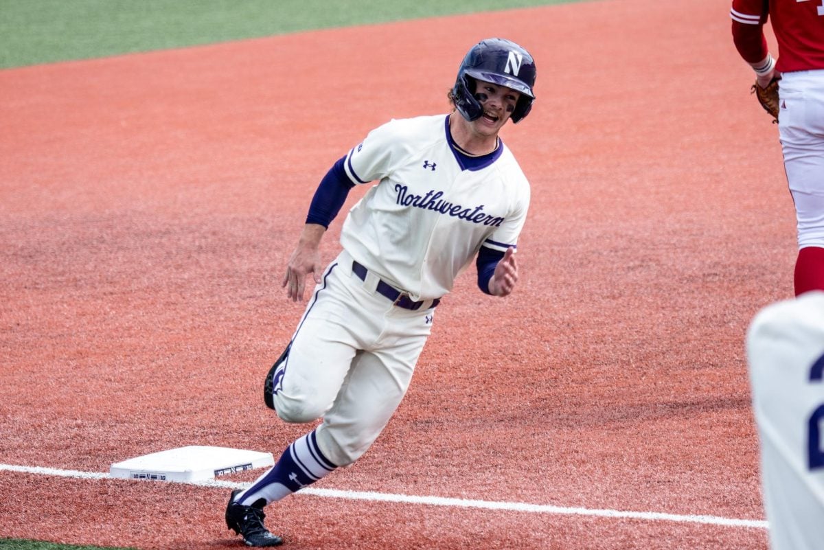 Junior utility player Preston Knott rounds third base. Knott collected two home runs in Northwestern’s game against Penn State Saturday.
