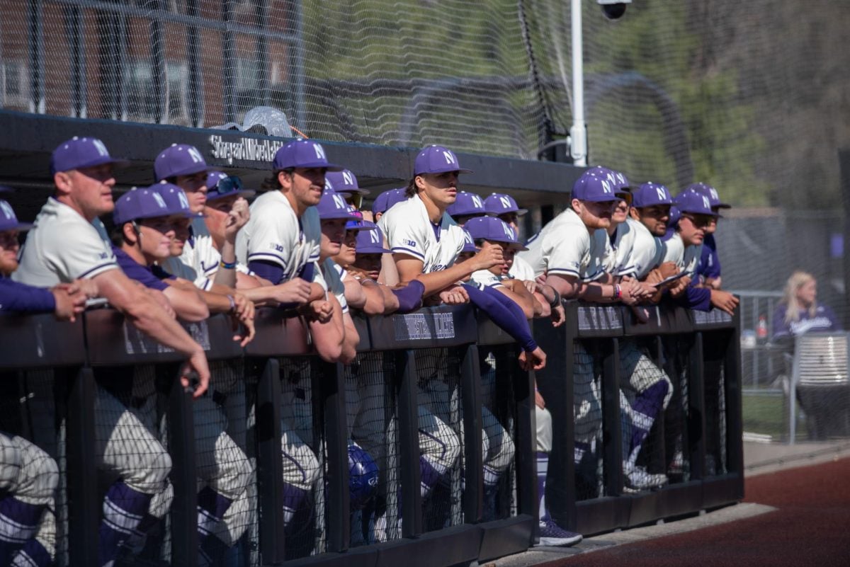 Northwestern bench watches the game in the final innings.
