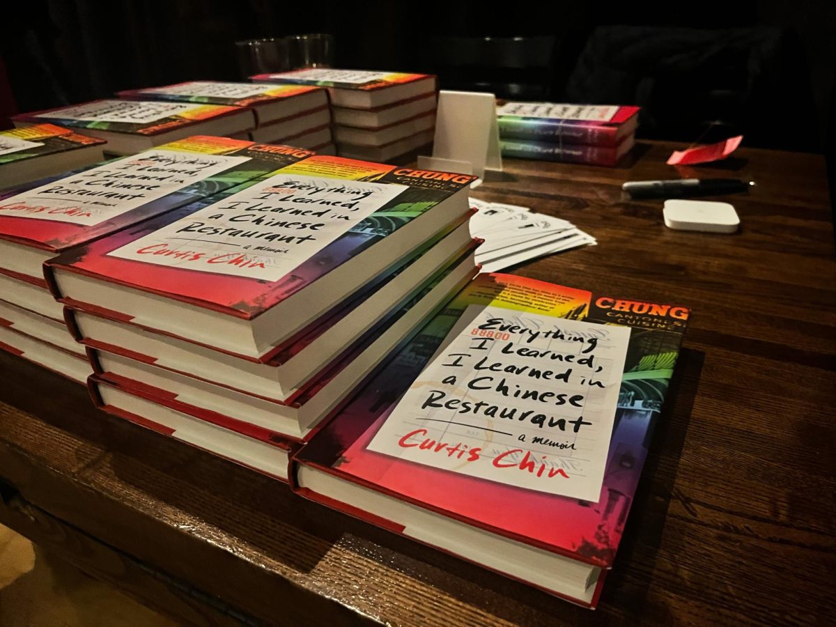Copies of Curtis Chin’s memoir sit on a table.