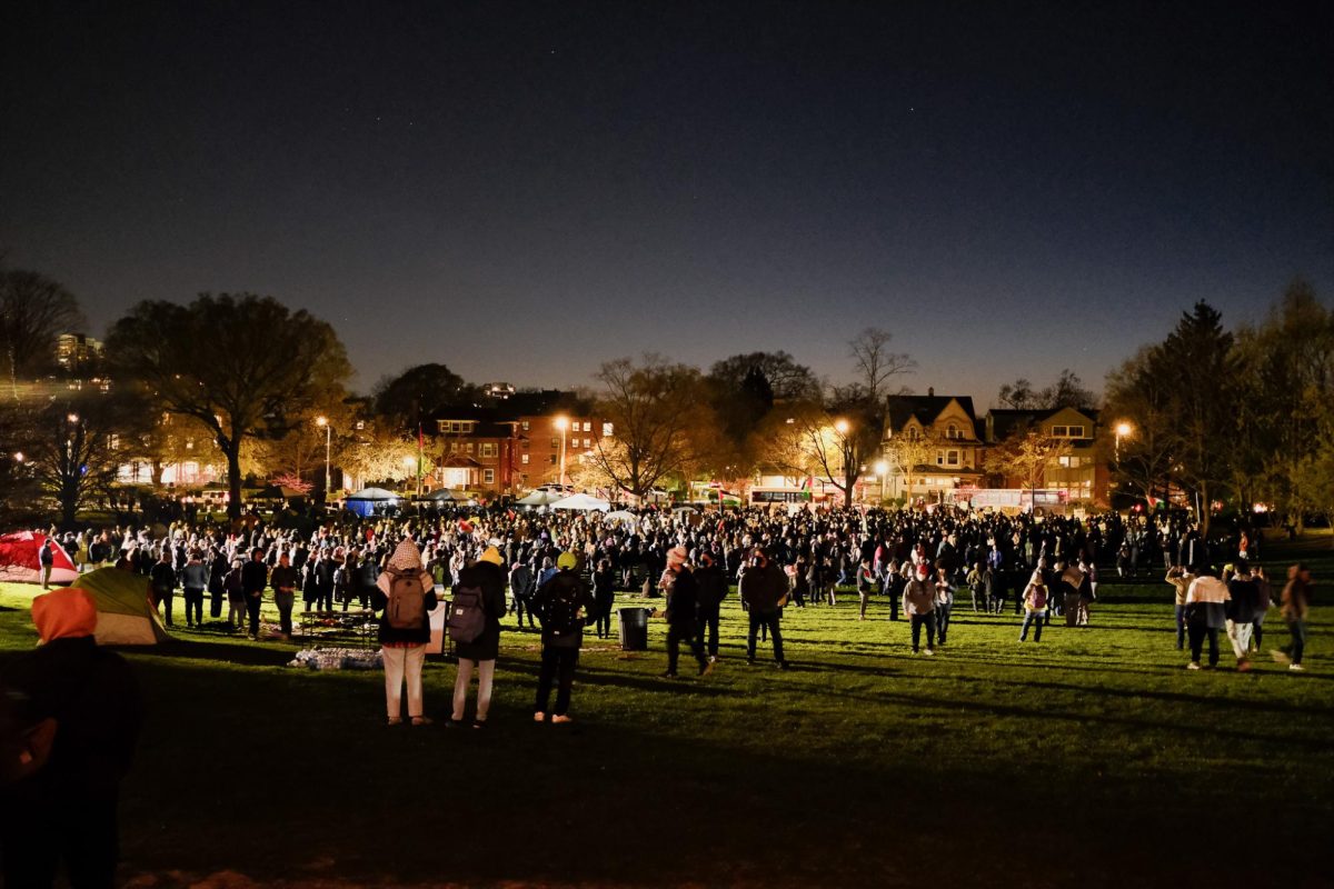 Hundreds gathered on Deering Meadow after sunset Thursday night despite the threat of police escalation.