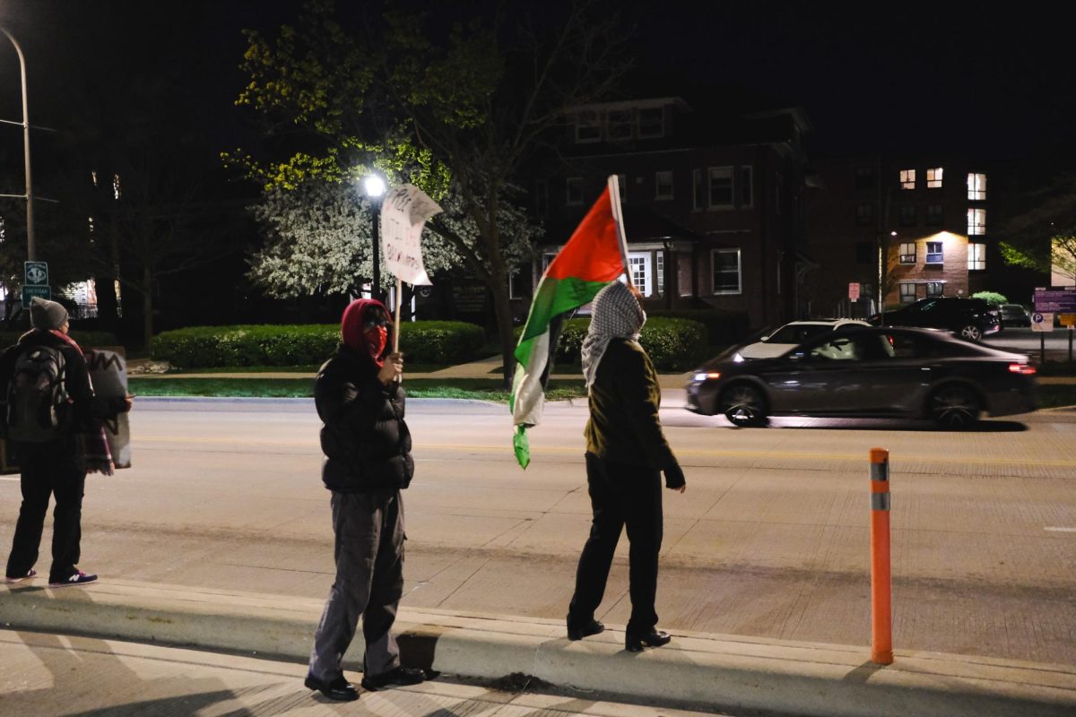 Supporters gathered outside Deering Meadow, encouraging cars to honk in solidarity as they drove by.