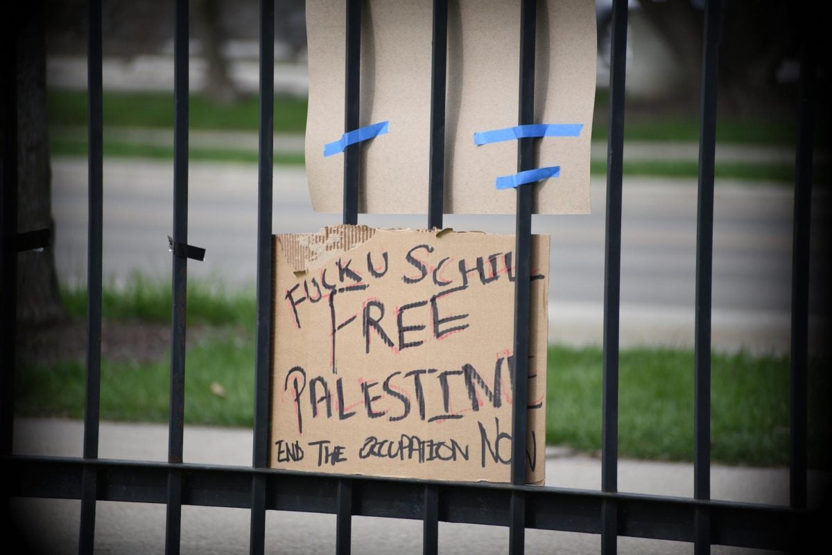 Several signs and banners on the fence between Deering Meadow and Sheridan Road called out Schill by name as the encampment entered its fifth day.