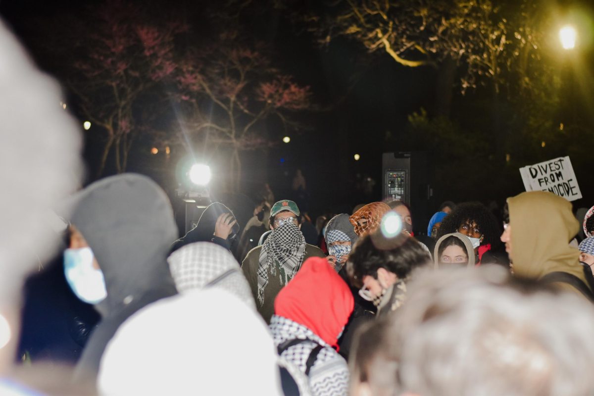 Later in the night, protesters gathered around a stage from which students led chants and played music.
