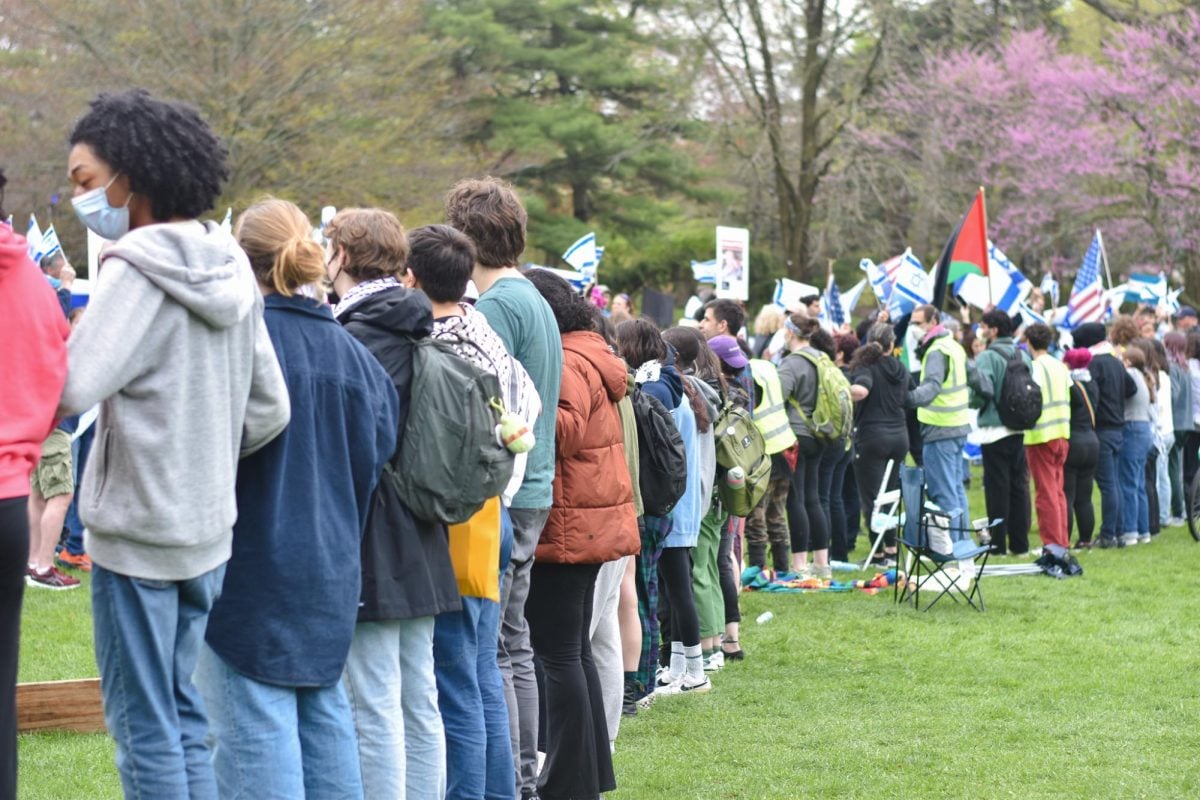 Demonstrators formed a human chain on Deering Meadow to prevent counterprotesters from entering their encampment.