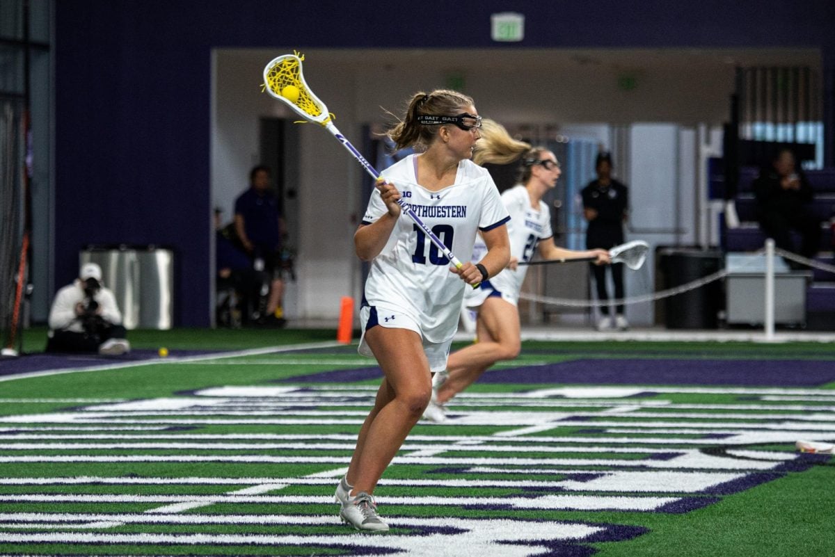 Graduate+student+attacker+Dylan+Amonte+surveys+her+attacking+options+from+behind+the+cage+in+the+March+30+Rutgers+matchup.+Amonte+scored+the+game-winning+goal+in+Northwestern%E2%80%99s+13-12+victory+over+Michigan+Sunday.