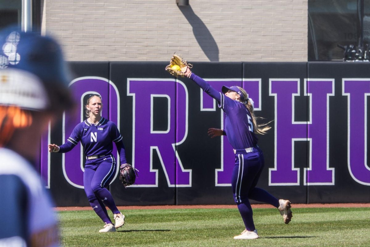 Northwestern’s Bridget Donahey makes a catch with her glove outstretched.