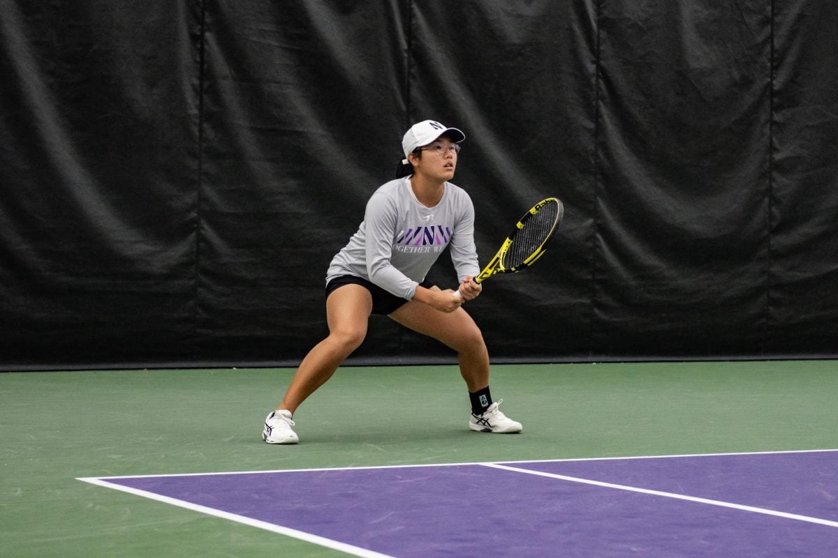 Senior+Justine+Leong+prepares+to+return+a+serve+against+Wisconsin.+Leong+lost+to+Wisconsin%E2%80%99s+Maria+Sholokhova+6-2%2C+6-1%2C+but+Northwestern+has+since+been+awarded+the+point+for+that+match.
