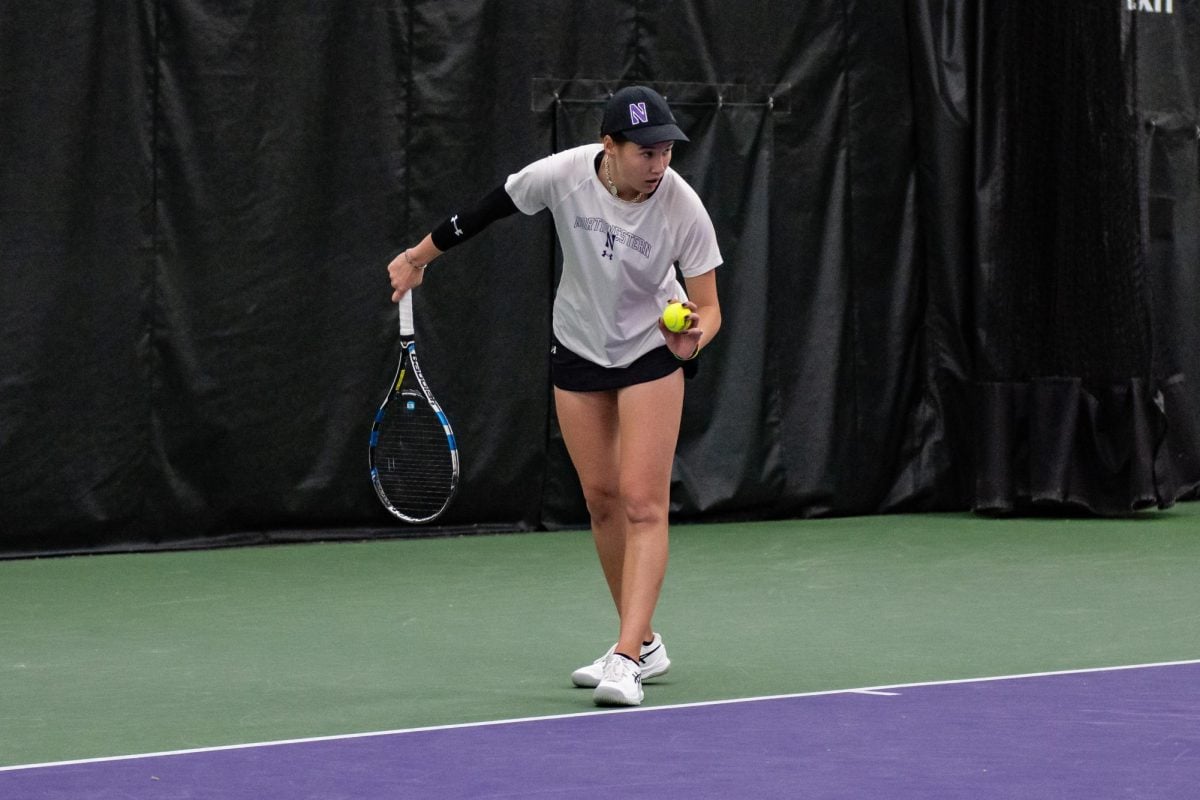 Graduate+student+Christina+Hand+gets+ready+to+serve+against+Wisconsin.+Hand+went+4-0+this+weekend+in+singles+and+doubles+without+dropping+a+set.