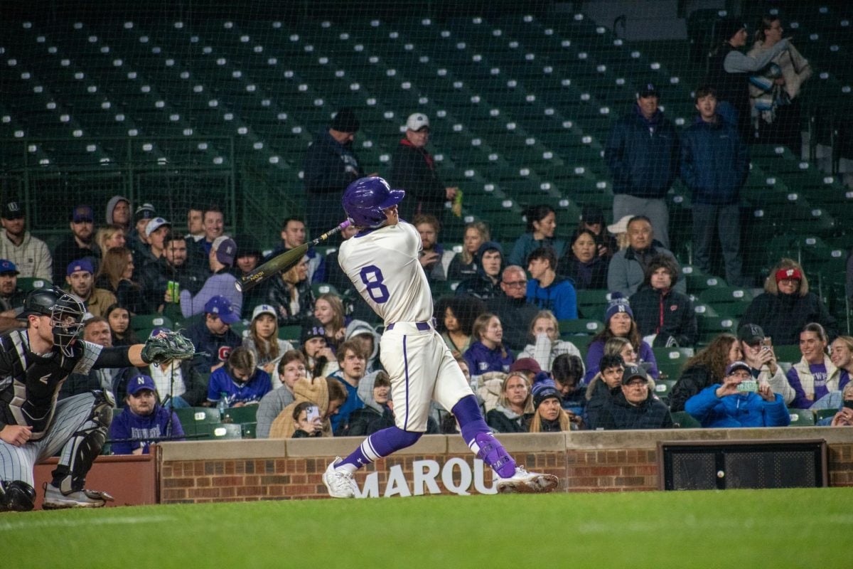 Sophomore infielder Owen McElfatrick hits a home run in Northwestern’s Friday loss to Purdue at Wrigley Field.

