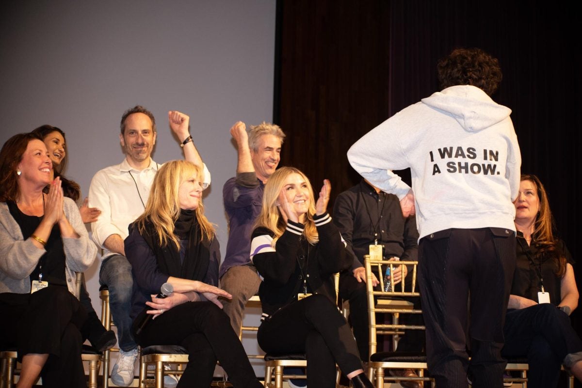 Kristen Schall (Bob’s Burgers) shows off her Mee-Ow hoodie from her days in the Northwestern student comedy group on the Actors & Characters panel of the Mee-Ow Show Fest.
Back row (L to R): Anjali Bhimani (Ms. Marvel), Dermot Mulroney (Hanna), Peter Grosz (VEEP), J.P. Manoux (Phil of the Future) Front row: Jean Villepique (Upright Citizens Brigade), Romy Rosemont (Glee), Jessica Lowe (Wrecked), Kristen Schall (Bobs Burgers), Ana Gasteyer (Saturday Night Live)