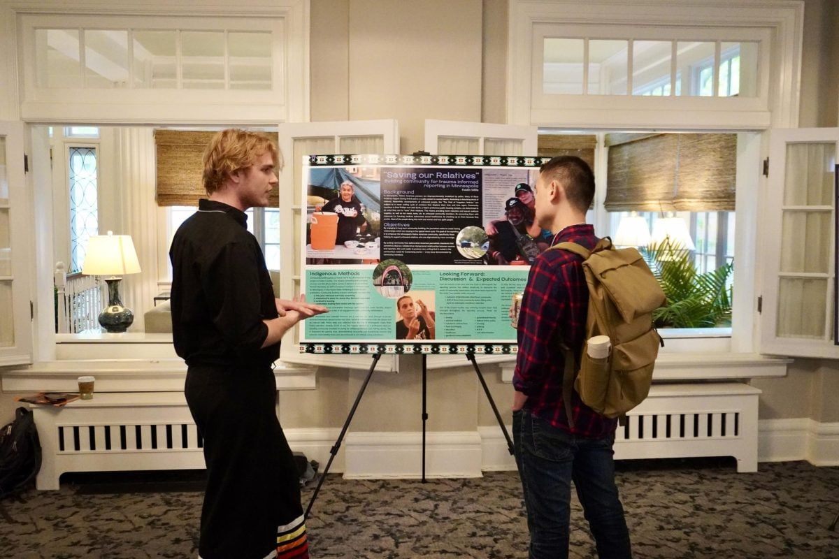 Medill senior and former Daily staffer Kadin Mills presenting his research poster.