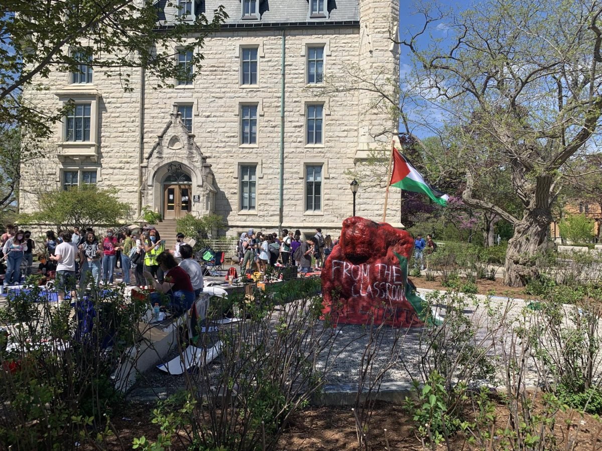 University representatives arrived at The Rock to hand out letters to demonstrators that said they were in violation of the University’s Code of Conduct.