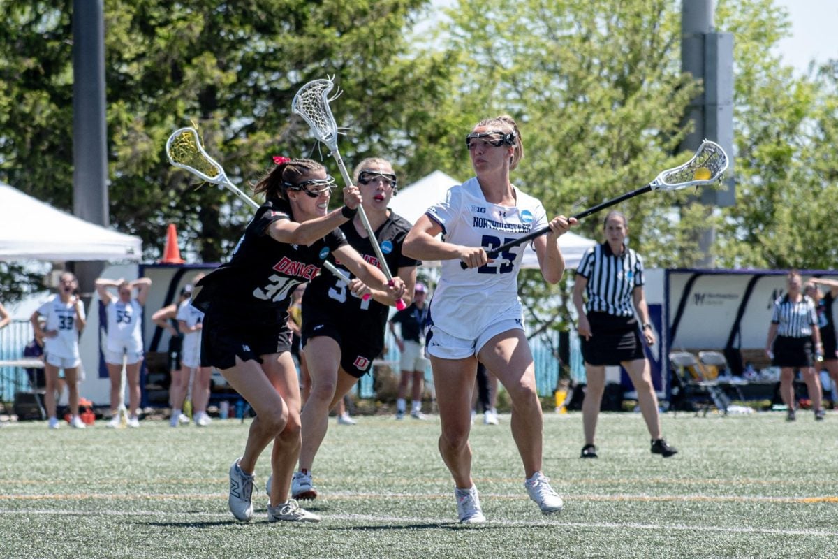 Sophomore attacker Madison Taylor eyes the cage against Denver. Taylor became the first Northwestern sophomore to record 100 points since Shannon Smith during Sunday’s victory.
