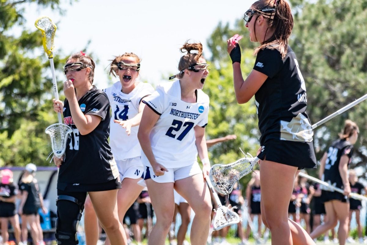 Graduate student attacker Izzy Scane celebrates after scoring her 359th career goal, clinching the NCAA Division I record for most career goals scored.