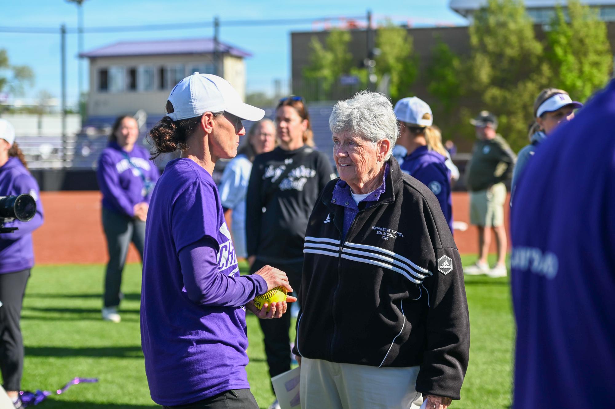 Coach Kate Drohan and former coach Sharon J. Drysdale talk after Northwestern secured its third-consecutive Big Ten regular season title.