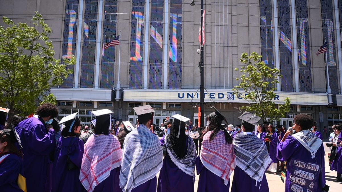 The protest outside the United Center in the University’s designated “free speech zone” saw over 100 people, including graduates who walked out, family members and community members.