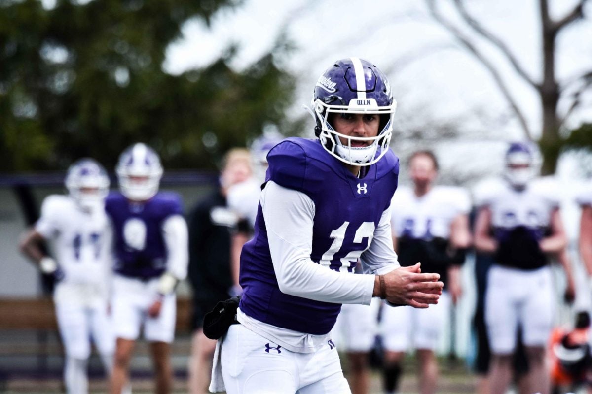 Redshirt sophomore quarterback Jack Lausch takes a snap during spring practice.