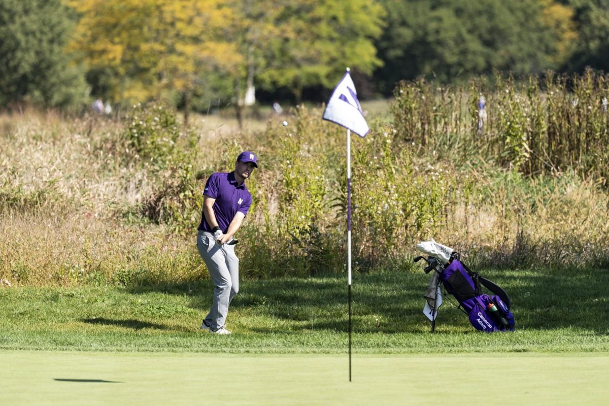 Senior Cameron Adam lines up a chip shot at the Windon Memorial Classic. Adam shot 4-under par through three rounds and led Northwestern to third place in the event.